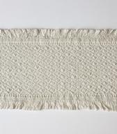 Čelnik iz bele platnene osnove, vezene z belo nitjo v gostem geometrijskem vzorcu / Javorniški Rovt / iz zbirke SEM / foto: J. Žagar. 